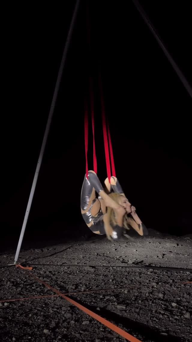 Dramatic aerial silks performance with red silks