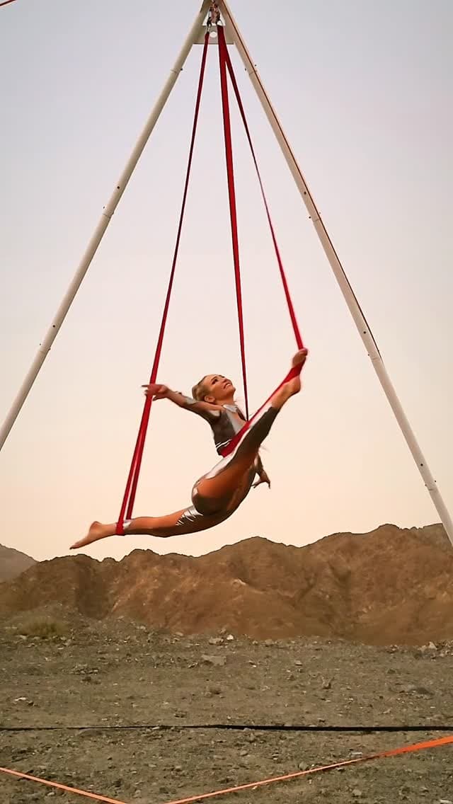Agata Krzywka performing aerial silks in the desert