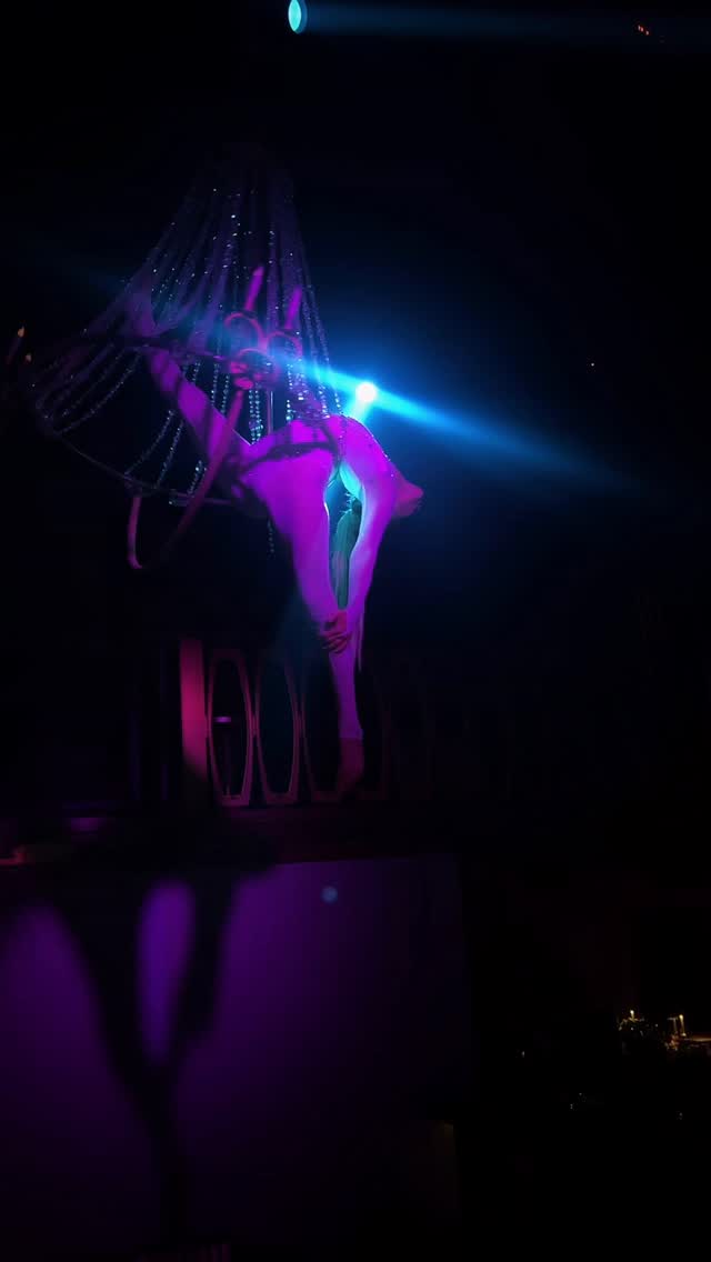 Blue-lit aerial performance